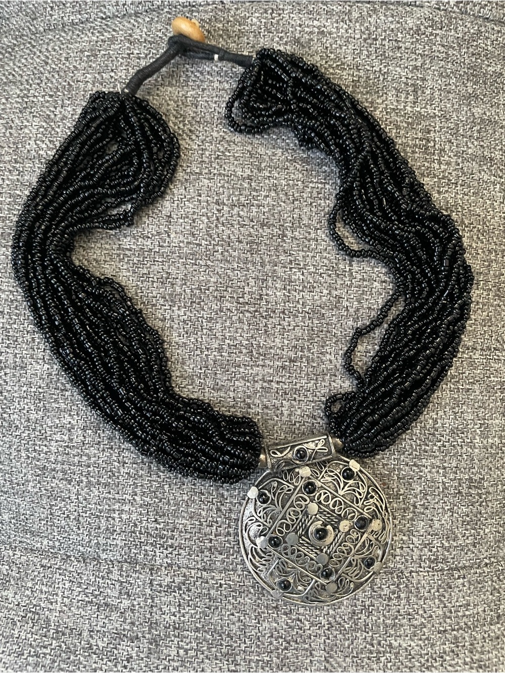 Black Beaded Necklace with Silver Pendant